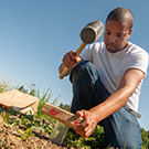 "A student gathering soil samples"