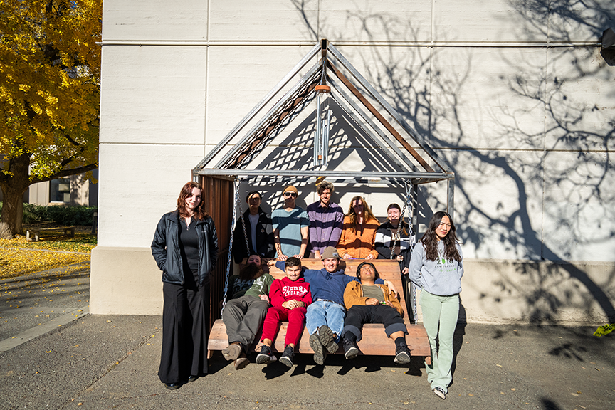 Students sit inside their structure.