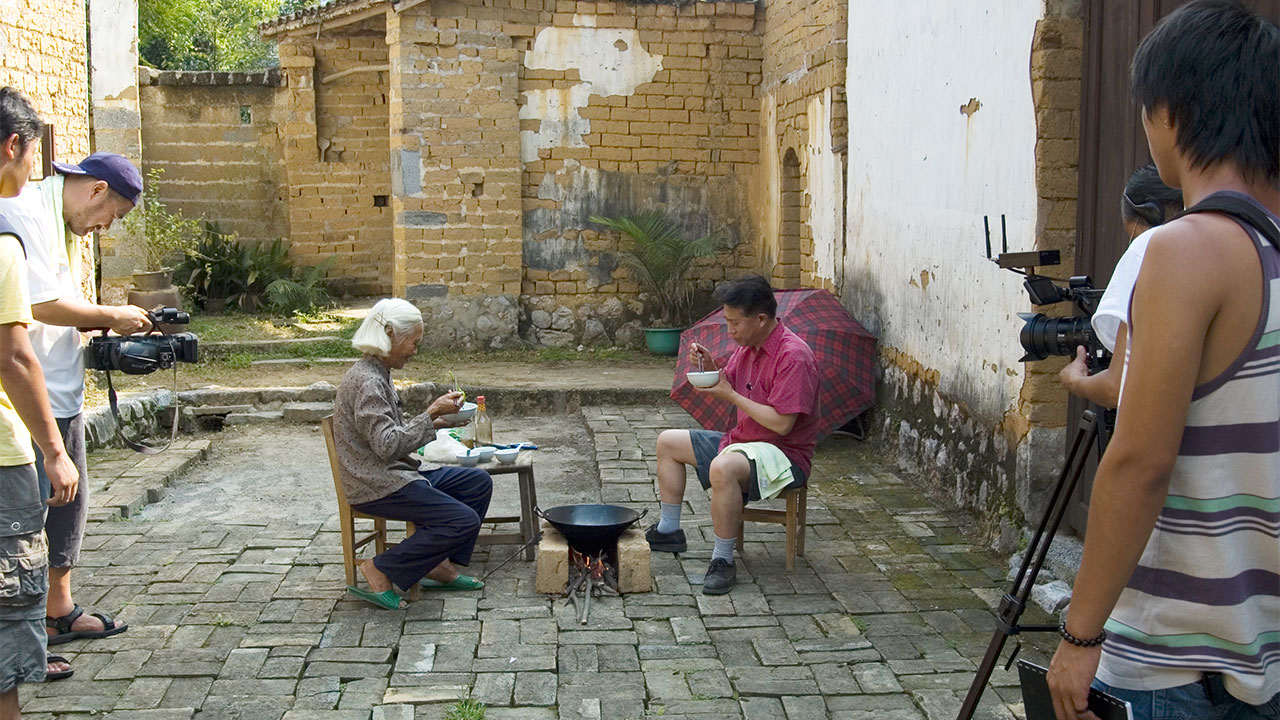 Martin Yan films a show in a village in Yangshuo, China in 2006. (UC Davis Library/Archives and Special Collections)