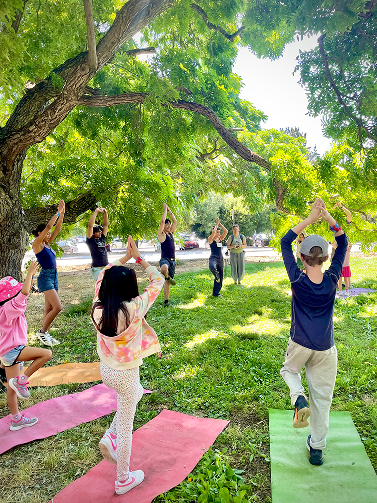 Yoga in the garden was led by UC Davis students who instructed the kids to try tree pose and cobra pose. Photo by: Tiffany Dobbyn, UC Davis