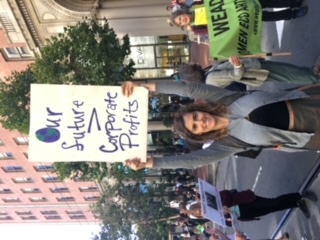 A women holding a protest sign