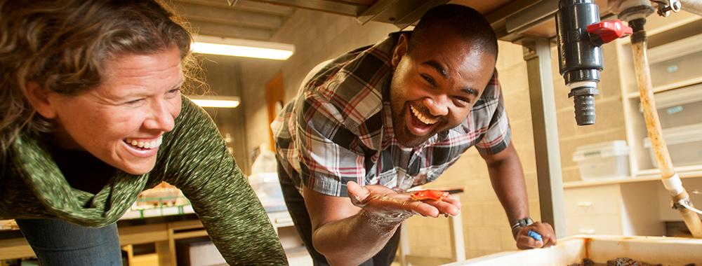A student holding a starfish during a class at the UC Davis Bodega Marine Lab.