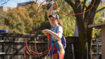 Fourth year Theatre and Dance major, Arden Siadeck tries dummy ropic at the Cole facility during UC Davis Picnic Day on April 15, 2023.