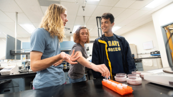 Students work in the lab to test water samples gathered at the Arboretum.