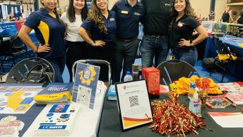 Vanessa Talavera (far left) represents UC Davis CA&ES at a college fair.