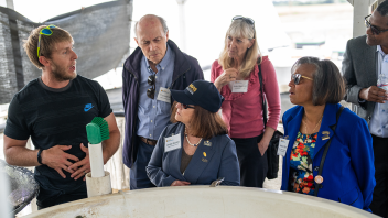 Dean Helene Dillard and members of the Dean’s Advisory Council get a tour of the Center for Aquatic Biology and Aquaculture on campus. (Jael Mackendorf/UC Davis)