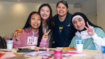 Students work on their valentines while attending UAP's Slice of Advising event.