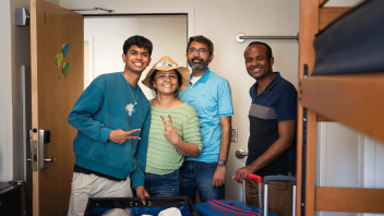 A family helps their new Aggie move in to the residence halls on campus.