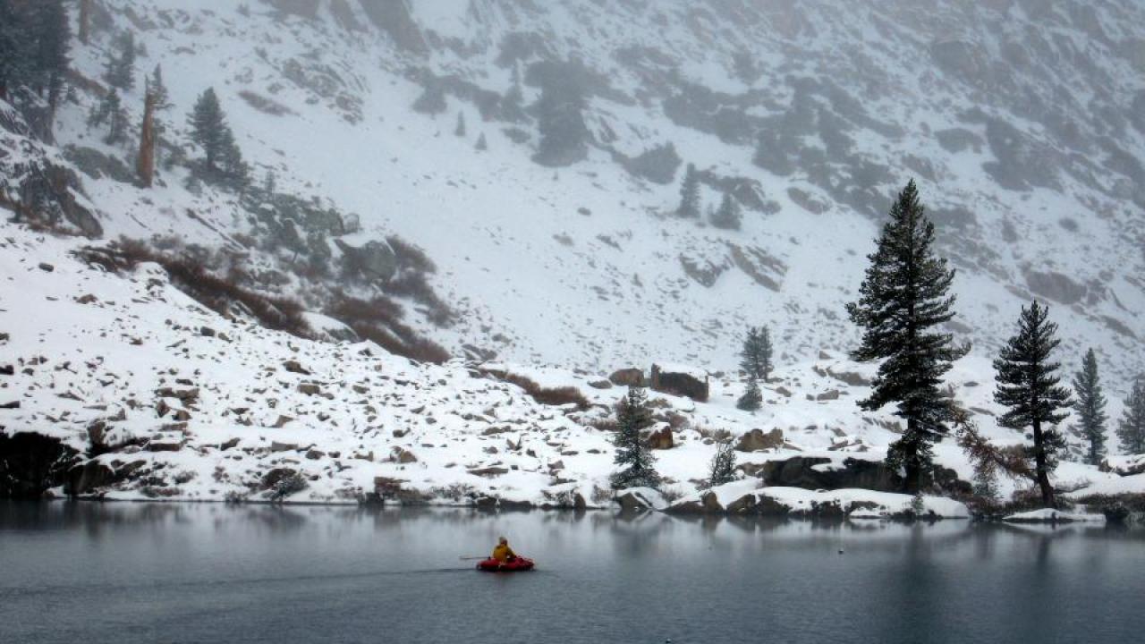 From his boat, Professor Steven Sadro collects samples of Emerald Lake in the Sierra Nevada mountains. (Kevin Skeen/UC Riverside) From his boat, Professor Steven Sadro collects samples of Emerald Lake in the Sierra Nevada mountains. (Kevin Skeen/UC Riverside)