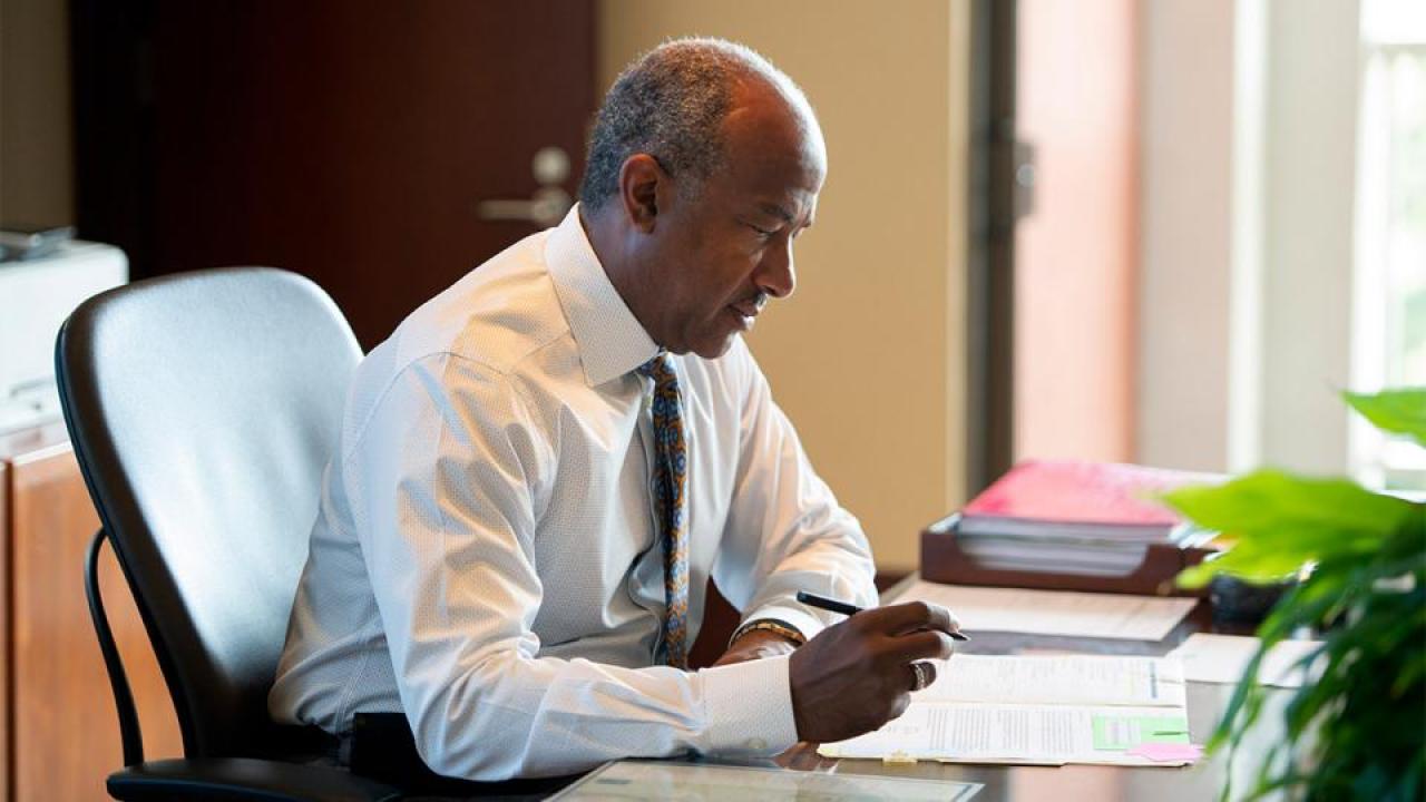 Chancellor Gary May at his desk.
