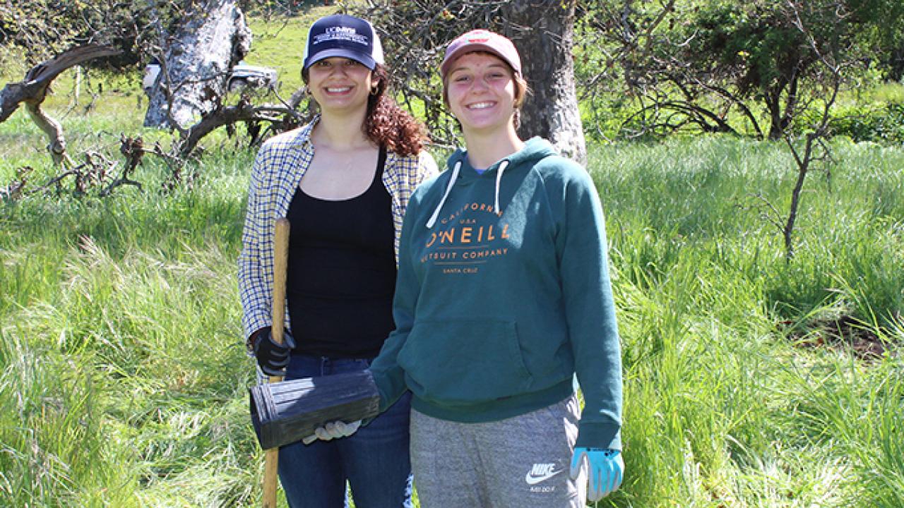 Students Carolina Vaquerano and Clarissa Arnaudo (left to right) plant native sycamore trees at Fort Ord National Monument as part of a spring break service trip to Monterey County. Courtesy Photo Students Carolina Vaquerano and Clarissa Arnaudo (left to right)