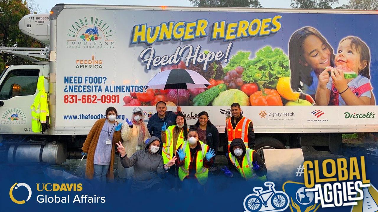 One of Michelle Lee’s (middle, blue-gloved peace sign) first impromptu drive-through distributions. Due to demand, her team ended up needing to switch locations and quadruple the amount of food normally sent to the site. One of Michelle Lee’s (middle, blue-gloved peace sign) first impromptu drive-through distributions. Due to demand, her team ended up needing to switch locations and quadruple the amount of food normally sent to the site.