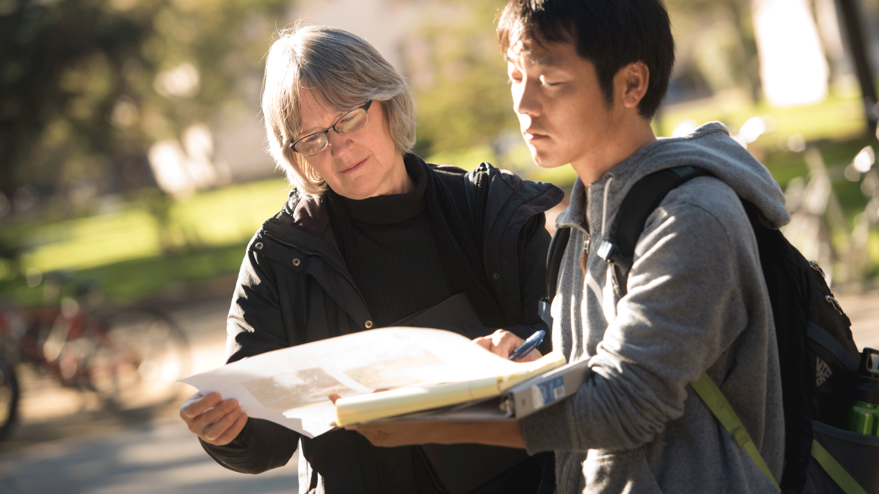 Sue Ebeler with student in the Arboretum.