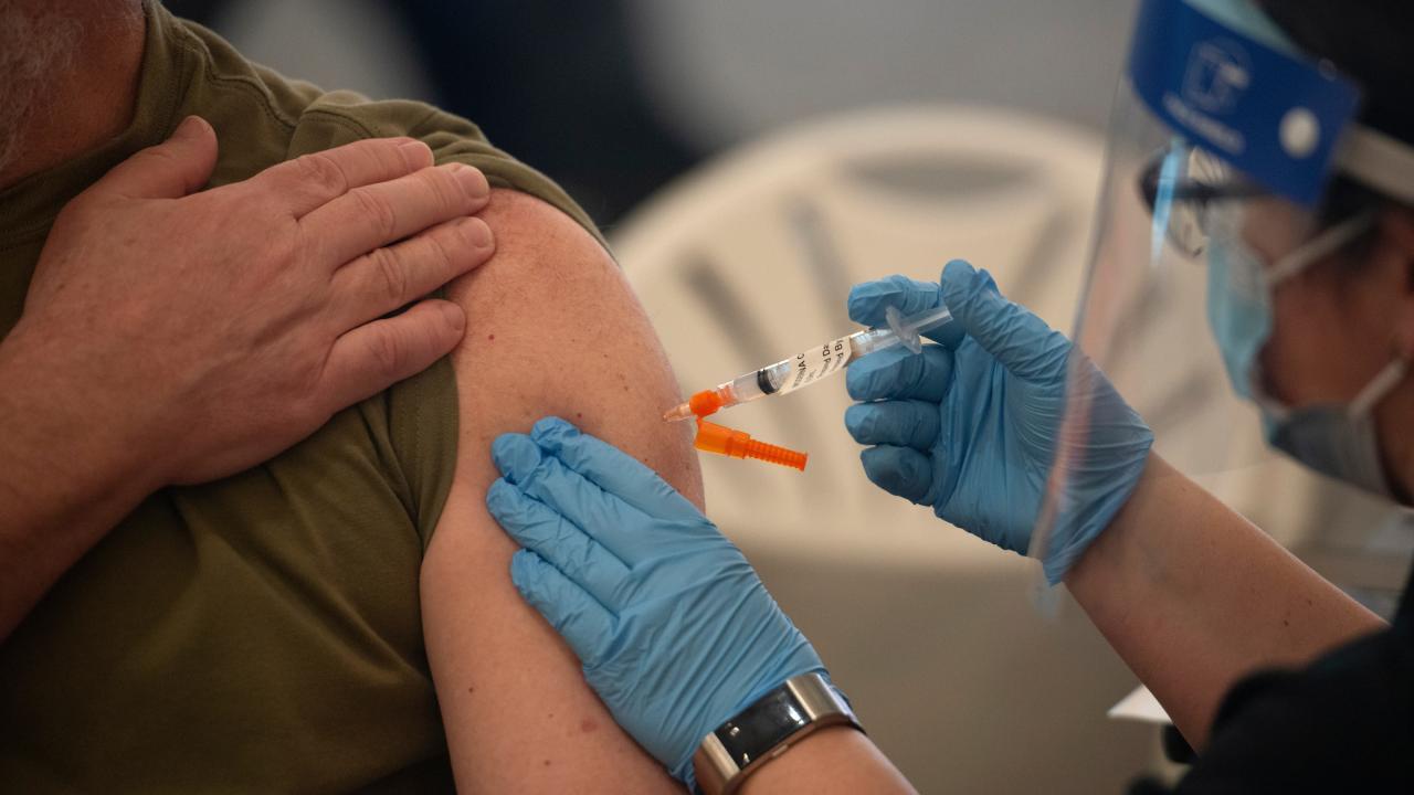 A person receiving a shot.
