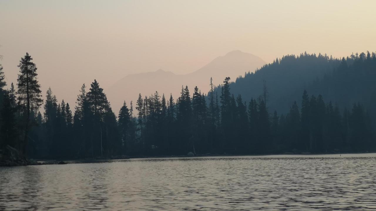 Smoke looms above Castle Lake in Siskiyou County after a wildfire. (Erin Suenaga, UNR)