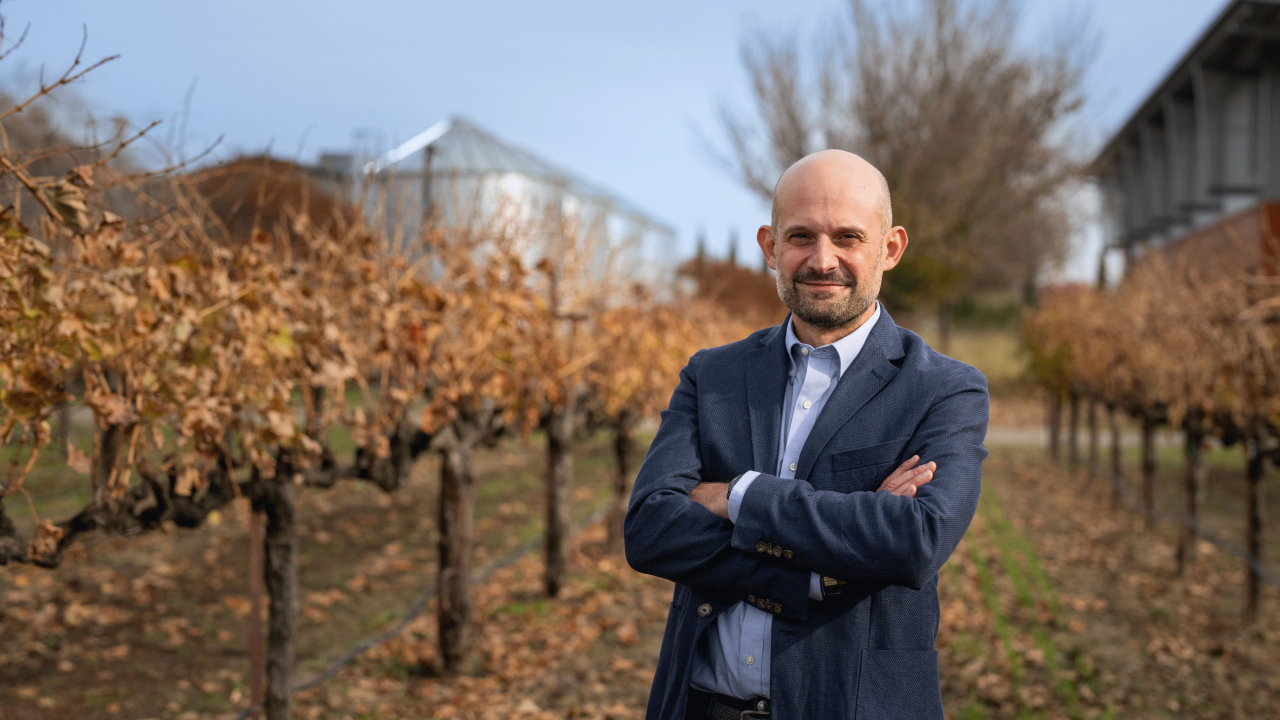 Dario Cantù, a professor in the Department of Viticulture and Enology, in the grape orchard outside the Robert Mondavi Institute for Wine and Food Science. (Jael Mackendorf/UC Davis)