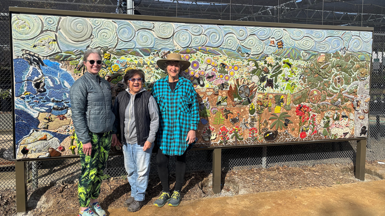 Emily Meineke, Gale Okumura and Diane Ullman after installing a part of the mural at the CALL Garden. Photo by: Valerie Jones