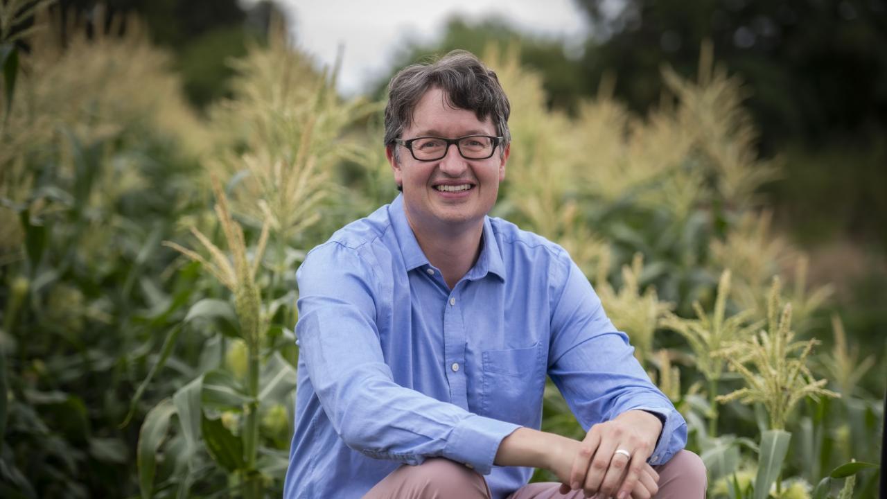 Ryan Galt sitting in a field