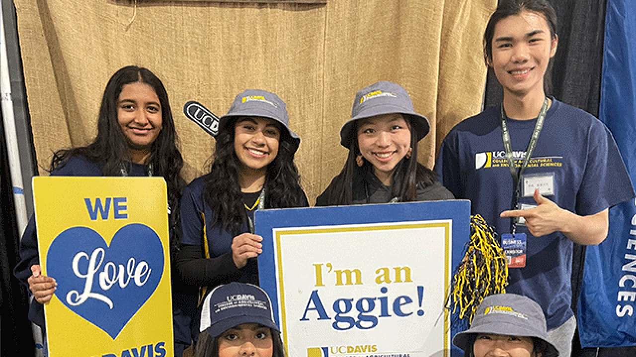 Students at the CA&ES booth in Tulare, CA during World Ag Expo.