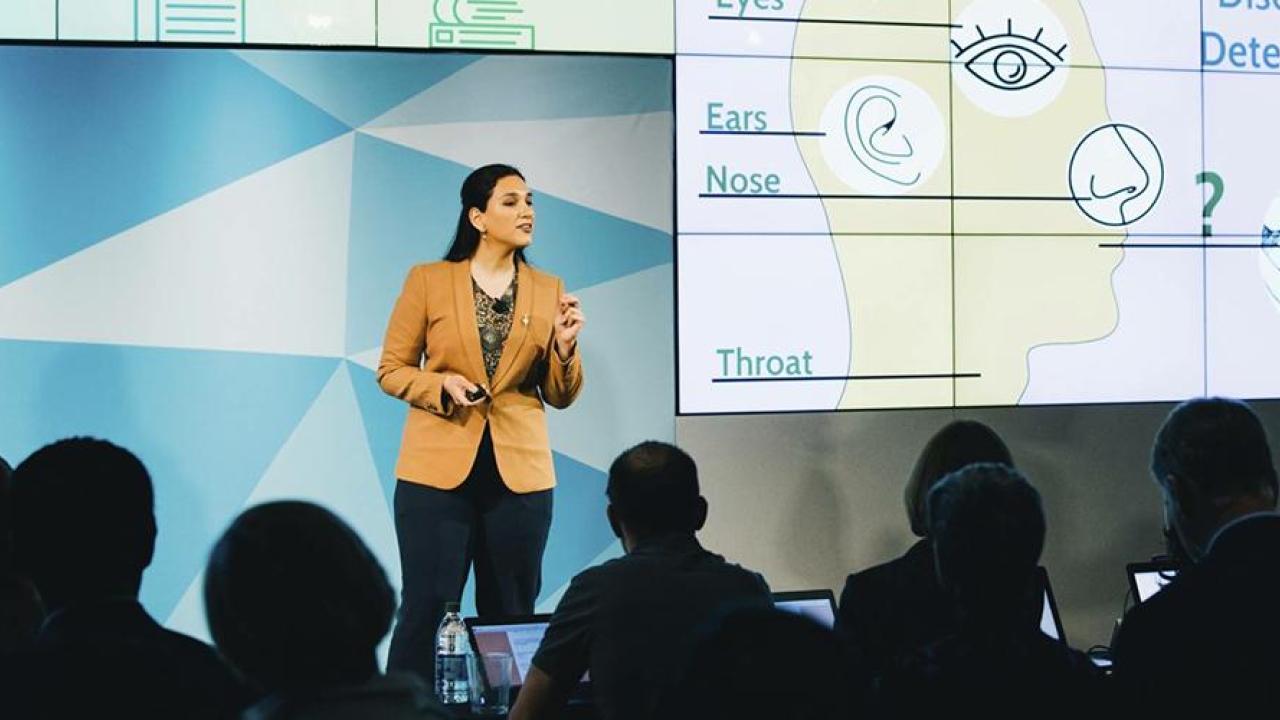 UC Davis Public Health graduate Tooka Zokaie presents research begun during her human development undergrad “At the Mouth of Health Access” at the UC Grad Slam finals.