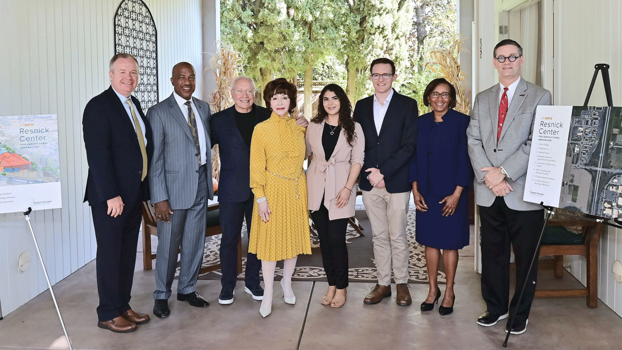 Celebrating the announcement, from left: Shaun Keister, vice chancellor of Development and Alumni Relations; Chancellor Gary S. May; Stewart Resnick; Lynda Resnick; Deysi Alvaro Ceja, a third-year plant sciences major; Christopher Simmons, professor and chair of the Department of Food Science and Technology; Helene Dillard, dean of the College of Agricultural and Environmental Sciences; and Jim Carroll, university architect and associate vice chancellor of Design and Construction Management. (Stefanie Keena