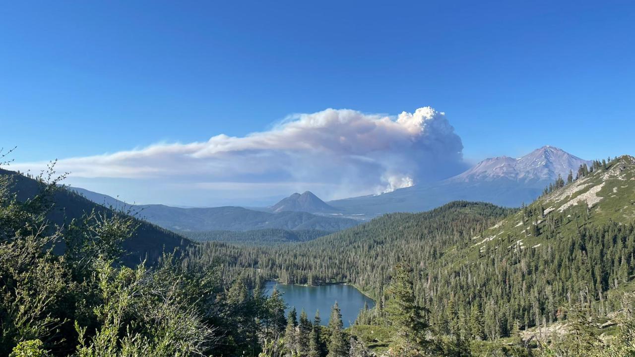 A wildfire smoke plume billows above Castle Lake, near Mount Shasta, on June 29, 2021. (Erin Suenaga/University of Nevada-Reno)