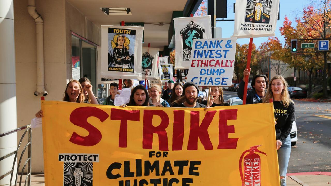 Young activists and their allies leading a climate strike in San Rafael, California, to demand action on climate change. This community protest took place on Dec. 6th, 2019 and was hosted by the Sunrise Movement, 350Marin, Sierra Club Marin and Sustainable San Rafael. Photo Credit: Fabrice Florin (Flickr)