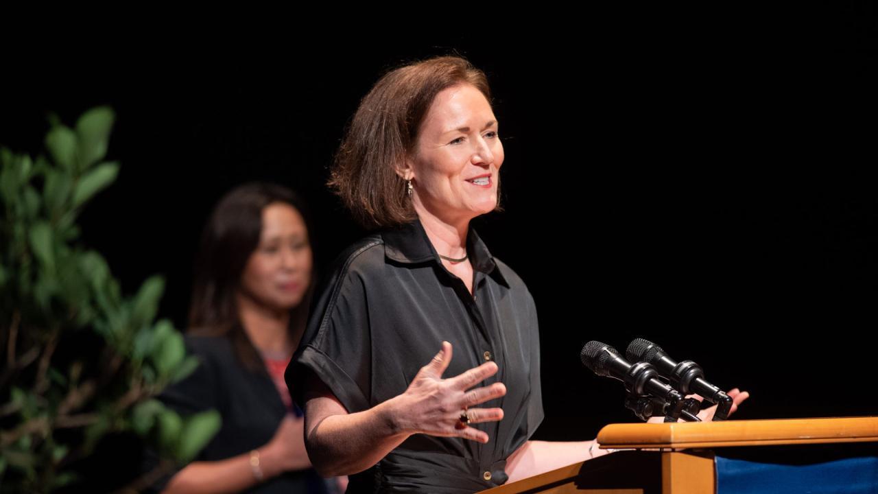 Human ecology professor Leigh Ann Simmons addresses Wisdom of Women symposium after winning the inaugural Women & Philantrhopy Impact Award Sunday (Oct. 16). (José Luis Villegas)
