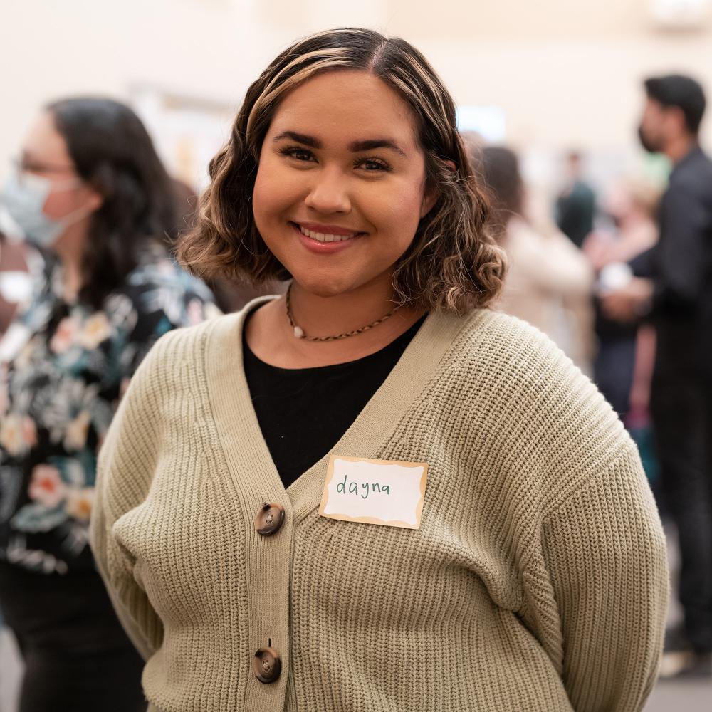 A student standing at an event.