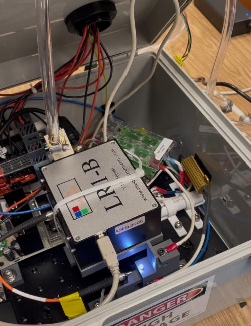 The TARTA works by capturing air particles through a nozzle, then using a spark (as seen) to release the particles as light, which can be analyzed to identify harmful metals such as lead, arsenic and chromium. Photo by: Tiffany Dobbyn, UC Davis
