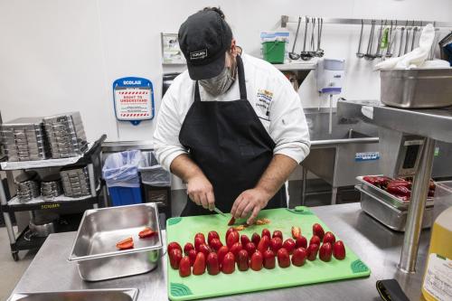 A chef preparing jalapeno poppers.