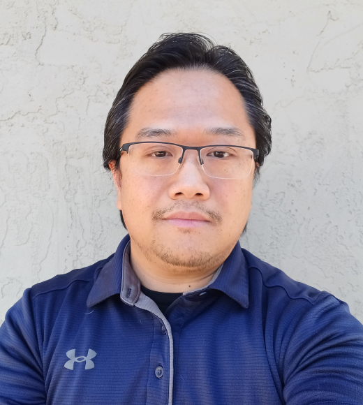 A person wearing a blue button up shirt.