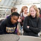 Students tour the small sturgeon tanks during an Animal Science 1 class at the Center for Aquatic Biology and Aquaculture.