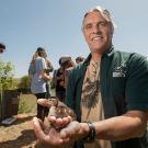 John Eadie holding a duckling
