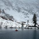 From his boat, Professor Steven Sadro collects samples of Emerald Lake in the Sierra Nevada mountains. (Kevin Skeen/UC Riverside)