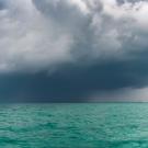 A typhoon moves over the sea in Thailand. Without the lightness of water vapor, the impacts of climate change to the tropics would be far worse, a UC Davis study found. (Getty)