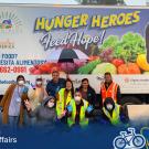 One of Michelle Lee’s (middle, blue-gloved peace sign) first impromptu drive-through distributions. Due to demand, her team ended up needing to switch locations and quadruple the amount of food normally sent to the site.