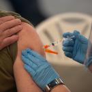 A person receiving a shot.