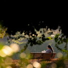A student studies while on a bench in the Arboretum on January 6, 2025.  