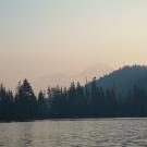 Smoke looms above Castle Lake in Siskiyou County after a wildfire. (Erin Suenaga, UNR)