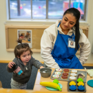 UC Davis student Jennifer Sanchez-Malagon with a child at the Early Childhood Lab School. Photo by: Jael Mackendorf, UC Davis.