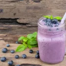 UC Davis researchers find that the right combination of blending fruits can give your body a nutritional boost. Photo shows banana and blueberry smoothie. (Getty)