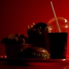 A collection of fast food items in front of a red background.