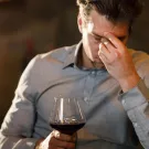 UC Davis scientists theorize that a flavanol found naturally in red wine can interfere with the metabolism of alcohol and cause a “red wine headache.” (Getty)