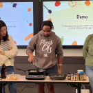 Makhi Jones (pictured center) gives cooking tutorial while participating in the Good Foods Garden internship.