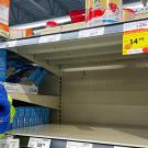 An empty shelf at a grocery store.