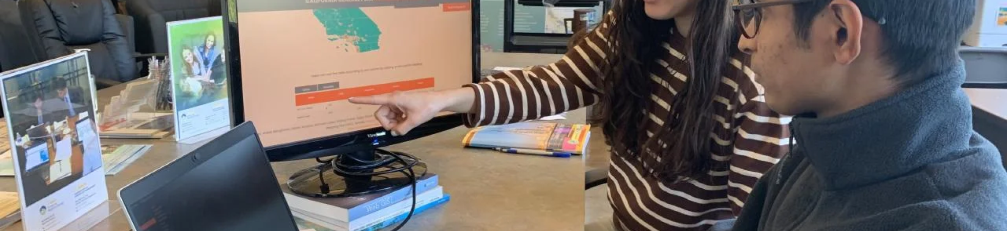 UC Davis graduate students Kamryn Kubose and Aniket Banginwar work on the General Plan Database Mapping tool they helped develop and troubleshoot. (Courtesy, UC Davis Center for Regional Change)