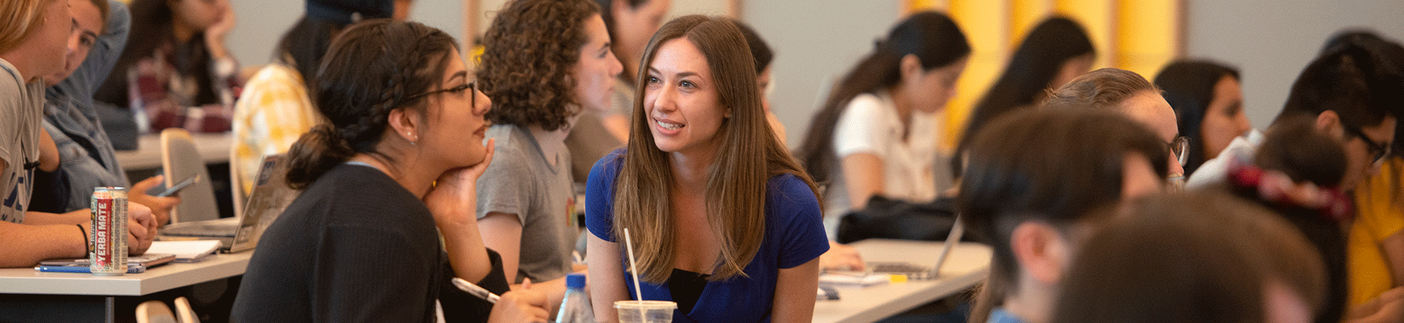 Lecturer Debbie Fetter talks with a student about her diet results during Nutrition 10 in California Hall.